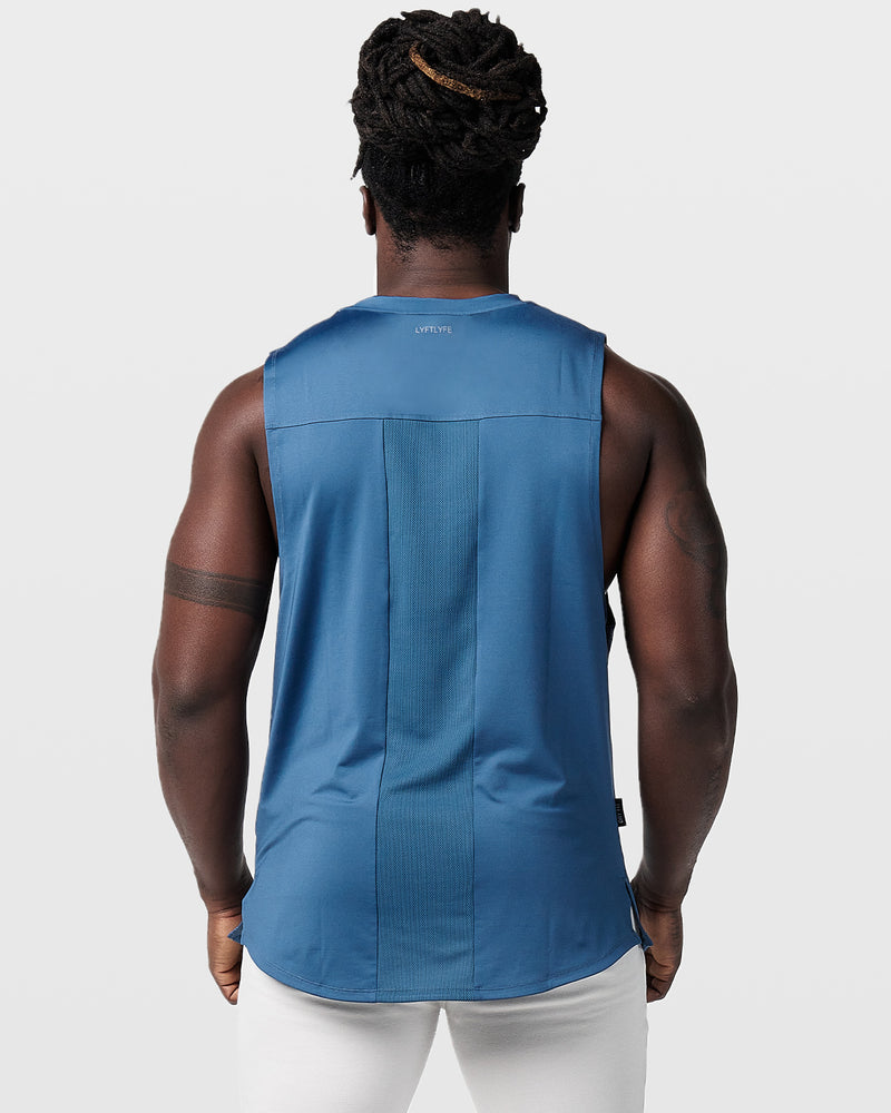 Dark blue mens sleeveless tank top with a reflective Dominate Adversity logo at center chest.