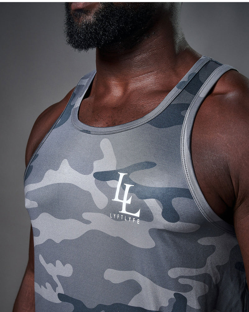 Mens tank top in blue camo with a white logo. 