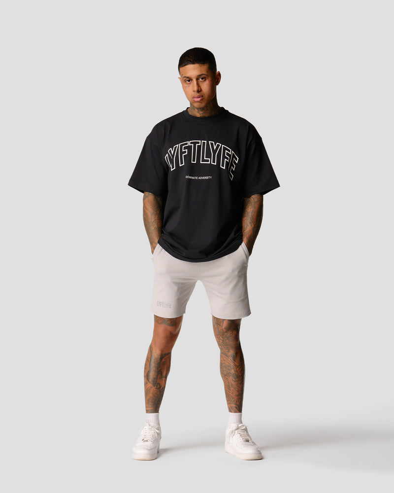 Oversized men’s T-shirt in black with a large white Lyftlyfe logo, made from soft premium cotton.