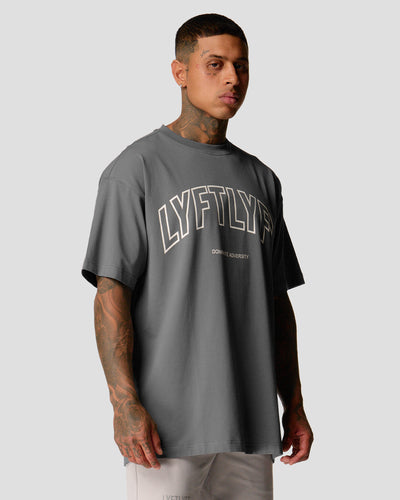 Men’s oversized grey T-shirt with Lyftlyfe logo and 'Dominate Adversity' slogan, made from soft premium cotton.