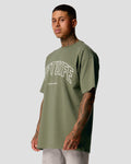 Left side view of Men’s oversized green T-shirt featuring the Lyftlyfe logo and 'Dominate Adversity' slogan on the chest.