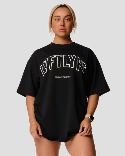 Women's oversized T-shirt in black, premium cotton, with a large Lyftlyfe logo on the chest.