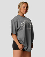 Right side view of Women's oversized T-shirt in red, cotton, with a large Lyftlyfe logo on the chest.