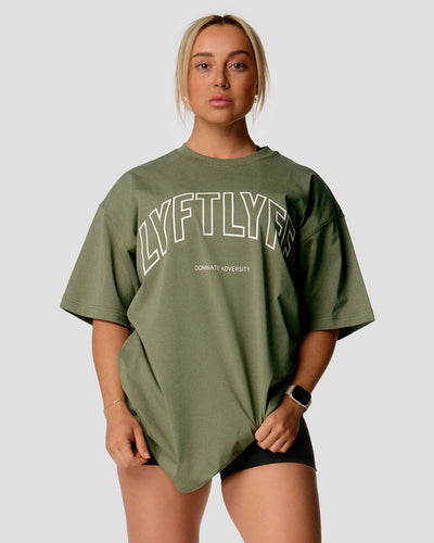 Green oversized t-shirt with 'LYFTLYFE' text on a light gray background