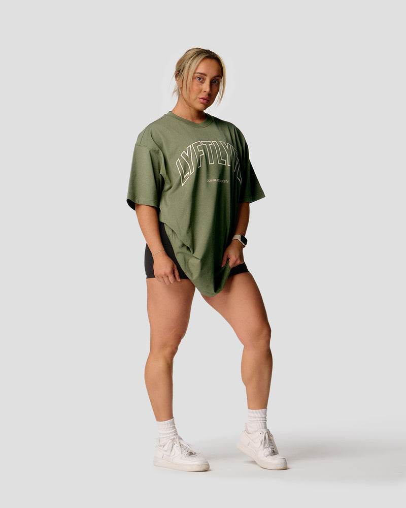 A female athlete is wearing a r, oversized T-shirt featuring a large lyftlyfe logo across the chest.green