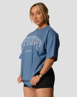 Left side view of Women's oversized T-shirt in blue with a white Lyftlyfe logo on the chest.
