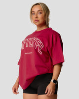 Left side view of Women's oversized T-shirt in red, cotton, with a large Lyftlyfe logo on the chest.