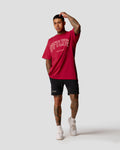 Men’s oversized red T-shirt with Lyftlyfe logo and 'Dominate Adversity' slogan, made from soft premium cotton.