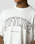 Highlight of the Lyftlyfe logo and slogan on a white oversized T-shirt for men.