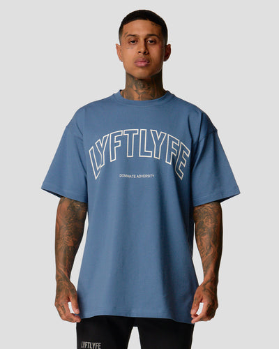 Blue oversized t-shirt with 'LYFTLYFE' text on a light gray background