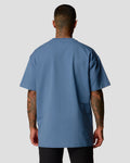 Back view of men's oversized T-shirt in blue, premium cotton, with a relaxed fit.