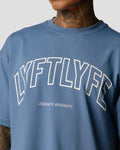Front chest detail of men's blue oversized T-shirt with bold Lyftlyfe branding.
