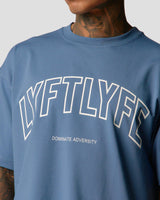 Front chest detail of men's blue oversized T-shirt with bold Lyftlyfe branding.