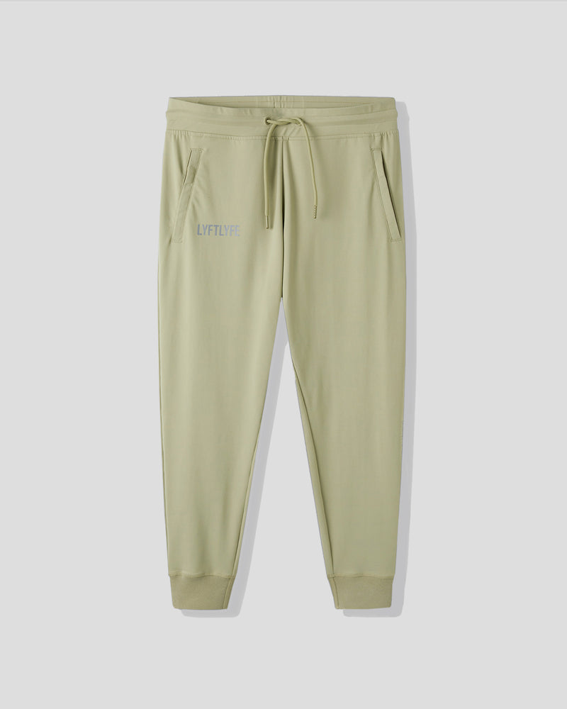 Light green sweatpants with a brand logo on a white background