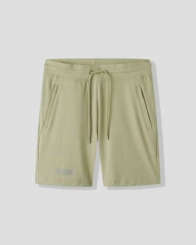 Light green shorts with a drawstring on a white background