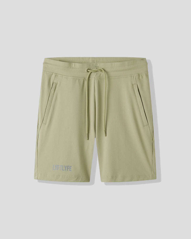 Light green shorts with a drawstring on a white background