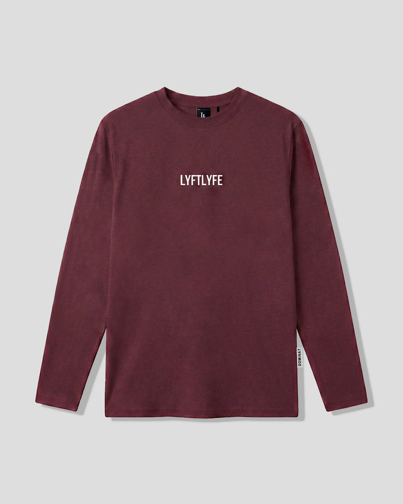 Men’s burgundy LYFTLYFE essential long sleeve shirt with white chest logo on light grey background.