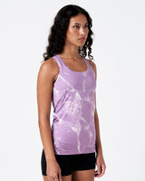 Right side angle of women’s light purple marble tank with racerback and curved hem.