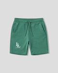 Green shorts with a logo on a light gray background