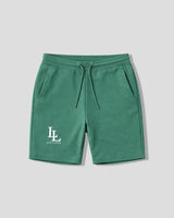 Green shorts with a logo on a light gray background