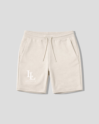 Beige shorts with a logo on a light gray background