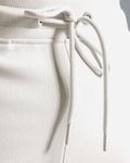 Detail shot of custom LYFTLYFE drawstring and elastic waistband in light grey.