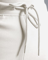 Detail shot of custom LYFTLYFE drawstring and elastic waistband in light grey.