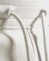 Detail shot of custom LYFTLYFE drawstring and elastic waistband in light grey.