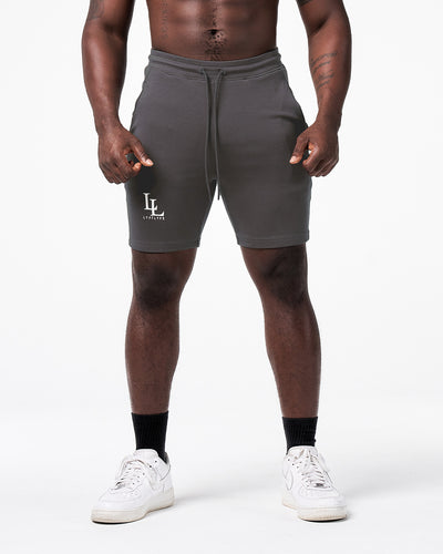 LYFT men’s gym shorts in dark grey with 3D rubber logo, designed for movement and performance.
