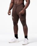 Left side view of Men’s dark brown LYFT shorts with elastic waistband and LL logo on right thigh.