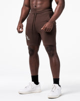Left side view of Men’s dark brown LYFT shorts with elastic waistband and LL logo on right thigh.