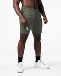 Right side view of LYFT shorts in green showing dual pocket seams and fitted athletic cut.