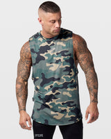 Front view of Limitless Men’s Cut Sleeve tank in green camo with reflective chest logo and scalloped hem.