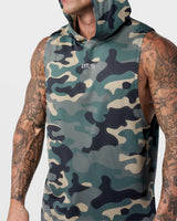 Close-up of reflective Lyftlyfe logo on center chest of green camo Limitless Sleeveless Hoodie, designed for visibility.