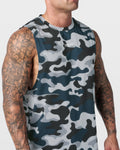Detailed view of chest logo on blue camo sleeveless gym top with high-tech fabric finish.