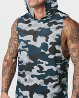 Detailed shot of reflective Lyftlyfe logo on front chest of Limitless gym tank in blue camo.
