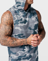 Detailed shot of reflective Lyftlyfe logo on front chest of Limitless gym tank in grey camo.