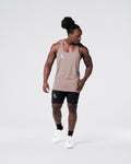 Head-to-toe look with gym stringer in rose and shorts in black. 