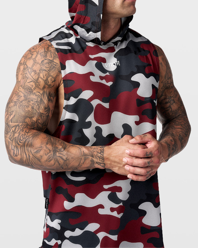 Men's sleeveless hoodie with red camo pattern.