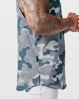 Detailed hem tag view of Limitless sleeveless grey camo tank, stitched with signature slogan.