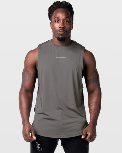 Mens sleeveless tank top in dark grey with a reflective Dominate Adversity logo at center chest.