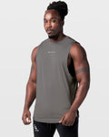 Grey athletic tank for men, shown from the left side with breathable construction and performance fabric.