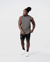 Front view Men’s sleeveless training tank in solid off-white, crafted with moisture-wicking tri-blend and minimal branding.