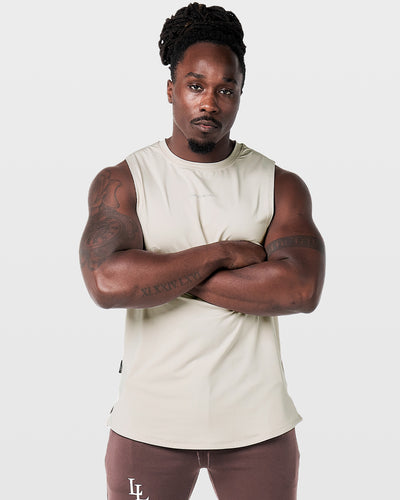 Beige sleeveless top on a light gray background