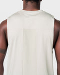 Close-up of ventilated back mesh on Limitless Cut Sleeve tank, enhancing airflow during training in off-white.