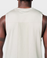 Close-up of ventilated back mesh on Limitless Cut Sleeve tank, enhancing airflow during training in off-white.