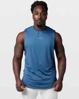 Dark blue mens sleeveless tank top with a reflective Dominate Adversity logo at center chest.