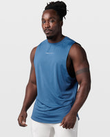 Left Side view of dark blue Limitless sleeveless gym tank, showing relaxed fit and ergonomic armhole design.