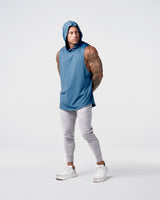 Side view of Limitless Men’s Sleeveless Hoodie in dark blue with hood, split hem, and reflective chest logo.