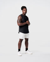 Limitless Men’s Cut Sleeve in black, side profile with split hem and wide shoulders for comfort and movement.